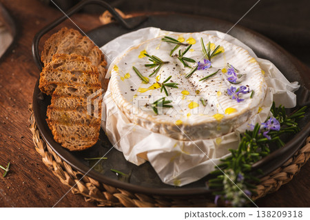 Baked Camembert Cheese with Rosemary and Toasted Bread Slices Baked Camembert Cheese with Rosemary and Toasted Bread Slices 138209318