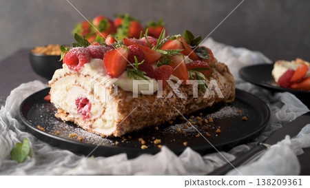 Sweet Berry Meringue Roulade with Cream and Fresh Strawberries Sweet Berry Meringue Roulade with Cream and Fresh Strawberries 138209361