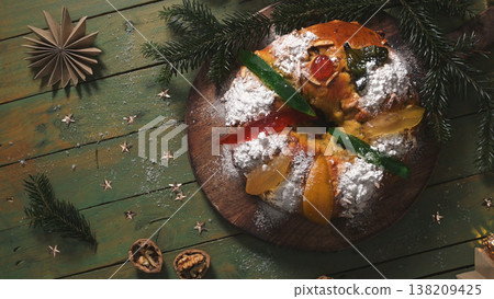Traditional Portuguese Bolo Rei Christmas Cake with Candied Fruit on a Rustic Table Traditional Portuguese Bolo Rei Christmas Cake with Candied Fruit on a Rustic Table 138209425