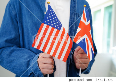 Learn English language, Asian teenage student hold book with flag in course at school. Learn English language, Asian teenage student hold book with flag in course at school. 138210320