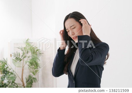 Woman in suit depressed Woman in suit depressed 138211509