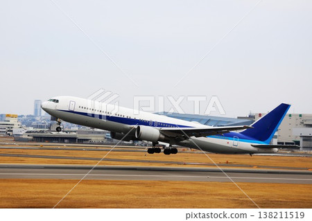 A plane taking off from the runway at Itami Airport in Osaka A plane taking off from the runway at Itami Airport in Osaka 138211519