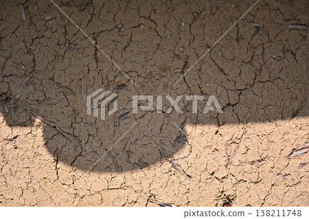 Shadow reflected on the earthen wall Shadow reflected on the earthen wall 138211748