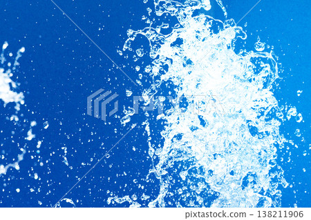 Close-up of fountain water droplets combined with blue paper Close-up of fountain water droplets combined with blue paper 138211906