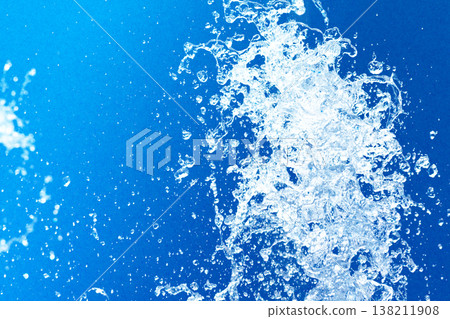 Close-up of fountain water droplets combined with blue paper 138211908
