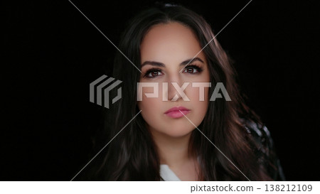 Confidence and Self-Esteem Portrait of a Serious Young Woman With Dark Hair and Pink Lipstick Confidence and Self-Esteem Portrait of a Serious Young Woman With Dark Hair and Pink Lipstick 138212109
