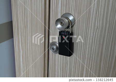 Key box attached to the door handle 138212645
