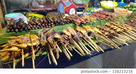 A night market in Luang Prabang, Laos, featuring freshly baked goods. A night market in Luang Prabang, Laos, featuring freshly baked goods. 138213216