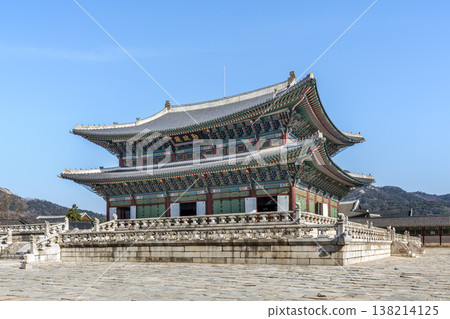 Traditional Korean Royal Architecture of Geunjeongjeon Hall under a Clear Blue Sky. 138214125