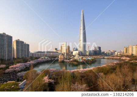 Aerial view of Lotte World Tower and Magic Island at Seokchon Lake during Spring season. 138214206