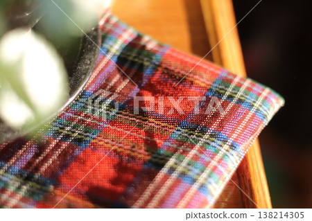 Folded Red Plaid Fabric After Christmas Folded Red Plaid Fabric After Christmas 138214305