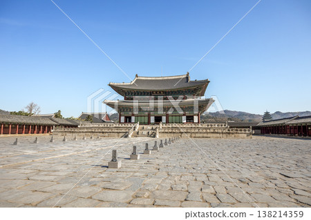High-angle panoramic view of Gwanghwamun Gate and Gyeongbokgung Palace in Seoul, South Korea, with a large crowd. High-angle panoramic view of Gwanghwamun Gate and Gyeongbokgung Palace in Seoul, South Korea, with a large crowd. 138214359