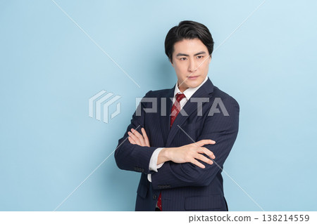 Cool businessman (blue background) Cool businessman (blue background) 138214559