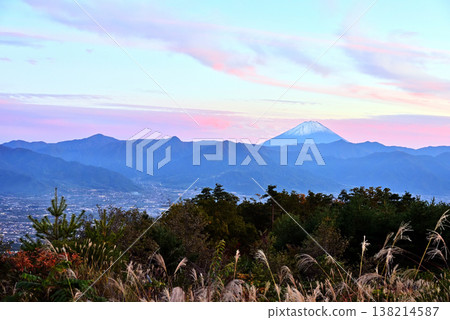 At dusk, Mount Fuji can be seen across the Kofu Basin. At dusk, Mount Fuji can be seen across the Kofu Basin. 138214587