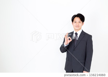 A middle-aged businessman making a circle pose. 138214860