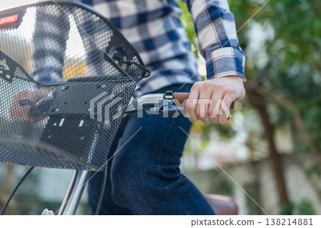 Hands of a person riding a bicycle Hands of a person riding a bicycle 138214881