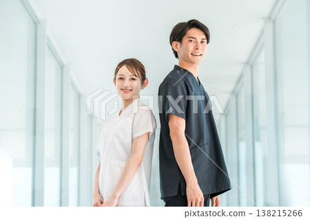 Medical workers in scrubs, medical staff, male doctors and female nurses in white coats Medical workers in scrubs, medical staff, male doctors and female nurses in white coats 138215266