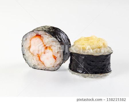 Two maki sushi rolls, one with shrimp filling and one baked with a cheese cap, isolated on a white background. Two maki sushi rolls, one with shrimp filling and one baked with a cheese cap, isolated on a white background. 138215382