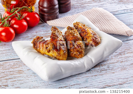 Baked chicken wings with spices Baked chicken wings with spices 138215400