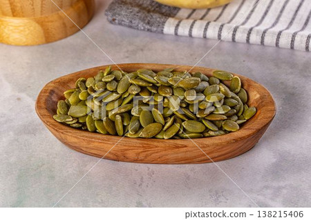 Fresh green pumpkin peeled seeds Fresh green pumpkin peeled seeds 138215406
