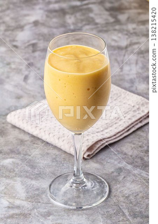 Sweet mango smoothie dessert glass 138215420
