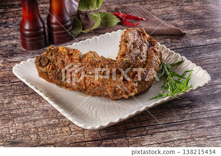 Baked pork sirloin with spices Baked pork sirloin with spices 138215434