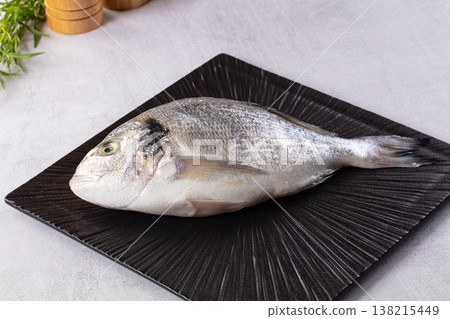 Raw fresh uncooked dorada fish Raw fresh uncooked dorada fish 138215449