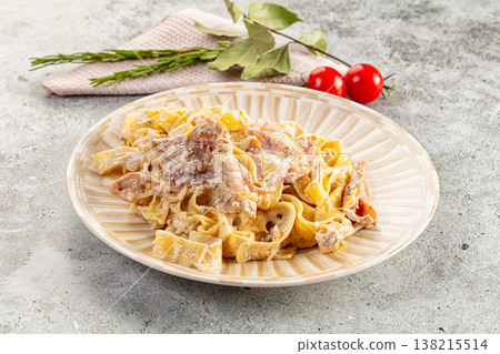 Italian pasta fettuccine with prosciutto Italian pasta fettuccine with prosciutto 138215514