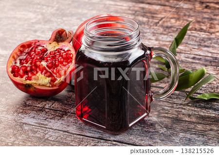 Sweet fresh pomegranate juice glass 138215526