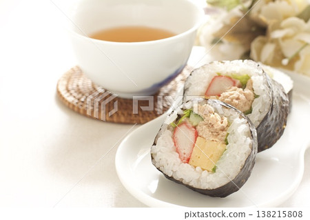 Thick sushi rolls and tea 138215808