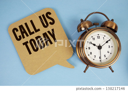 Call Us Today text with alarm clock on blue background 138217146