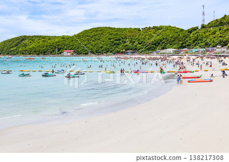 A beach with a clear blue sky and lots of people A beach with a clear blue sky and lots of people 138217308