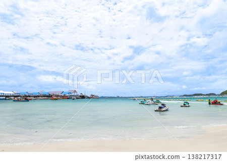 A beach under a clear blue sky 138217317