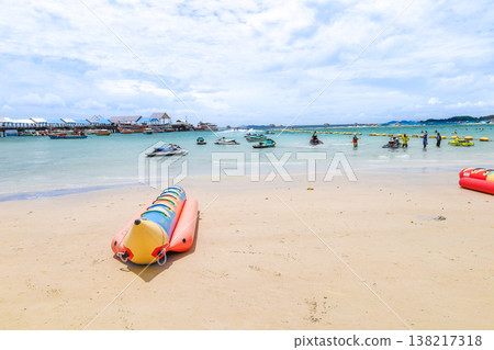 A beach under a clear blue sky and a banana boat A beach under a clear blue sky and a banana boat 138217318
