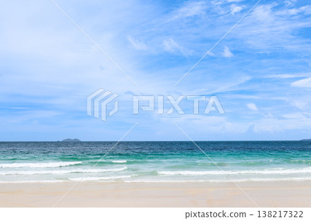 A beach under a clear blue sky A beach under a clear blue sky 138217322
