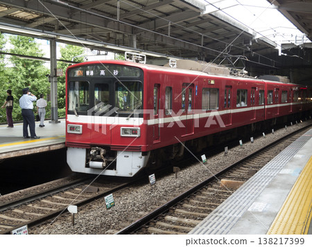 A train conductor prepares for departure at Keikyu Shinagawa Station. A train conductor prepares for departure at Keikyu Shinagawa Station. 138217399