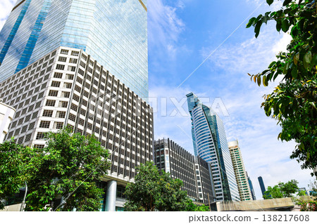 A cityscape with greenery and buildings 138217608