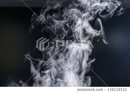 Steam rising from boiling hot water Steam rising from boiling hot water 138218532