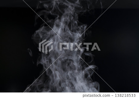 Steam rising from boiling hot water Steam rising from boiling hot water 138218533