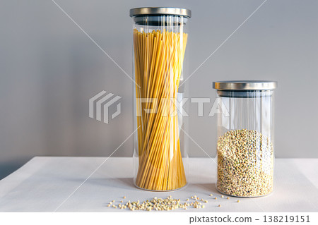 Spaghetti and cereals in glass jars, isolated. Spaghetti and cereals in glass jars, isolated. 138219151