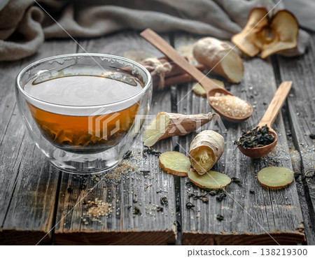 still life with transparent Cup of tea on wooden background 138219300