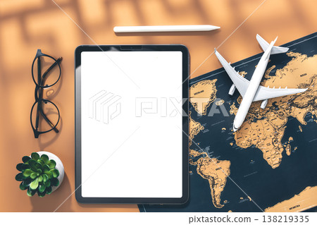 Tablet, airplane miniature and world map, flat lay. 138219335