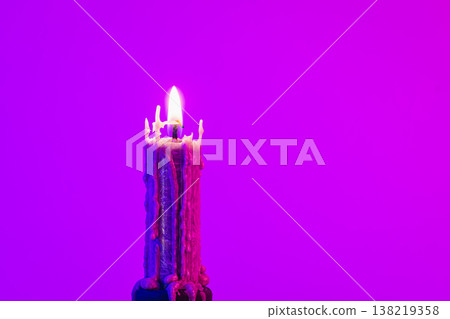 Texture vintage candle on a pink background with neon lighting, copy space. Texture vintage candle on a pink background with neon lighting, copy space. 138219358