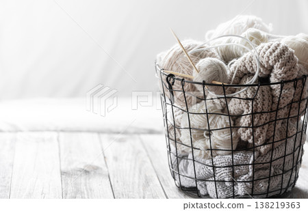 Threads for knitting in the black basket. Home Comfort and hobby. Background close up. Threads for knitting in the black basket. Home Comfort and hobby. Background close up. 138219363