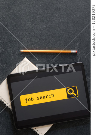 Top view of digital tablet with search job on screen. 138219372
