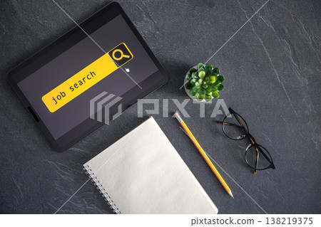 Top view of digital tablet with search job on screen on a table. 138219375