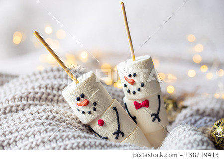 Two happy funny marshmallow snowmen, Christmas winter holiday decoration. 138219413