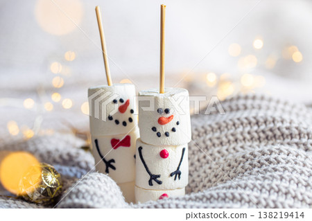 Two happy funny marshmallow snowmen, Christmas winter holiday decoration. 138219414