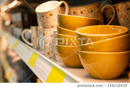 Variety of bowls and cups in modern household shop. Variety of bowls and cups in modern household shop. 138219439