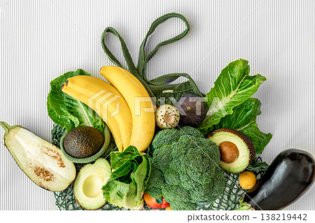 A variety of fresh vegetables and fruits on a white background, flat lay. 138219442